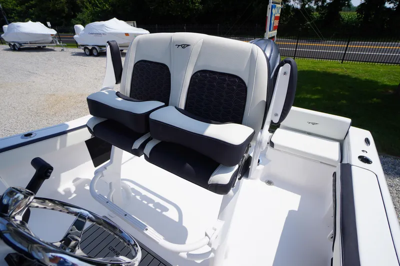 Slide: The Image of 2026 Tidewater 198 CC Adventure boat interior with dual seats and steering wheel. - 33