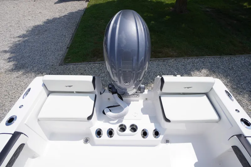 Slide: The Image of 2026 Tidewater 198 CC Adventure boat with sleek seating and powerful outboard motor. - 36