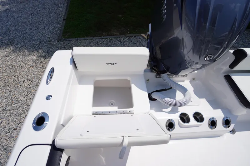Slide: The Image of 2026 Tidewater 198 CC Adventure boat interior with engine and seating area. - 37
