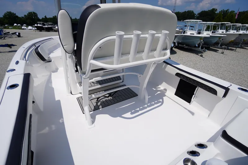 Slide: The Image of 2026 Tidewater 198 CC Adventure boat interior with rod holders and seating. - 39