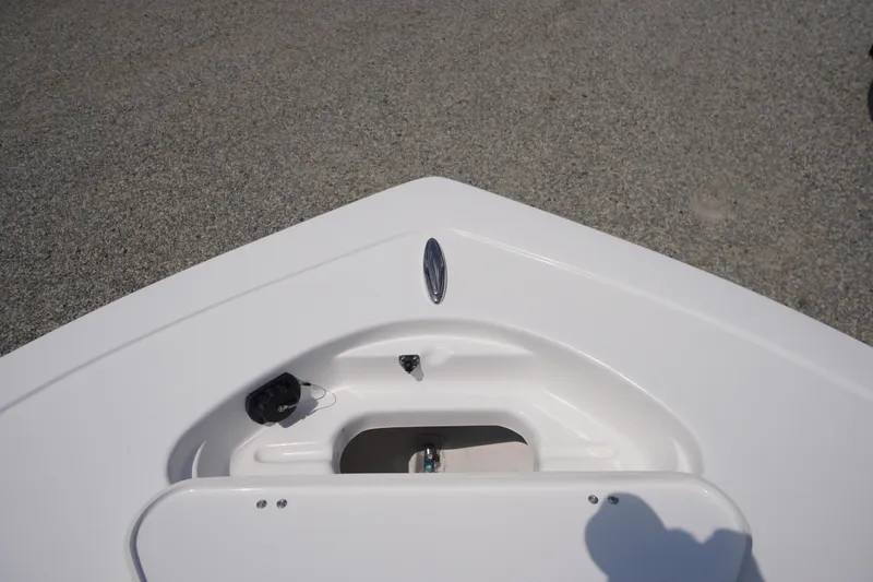 Slide: The Image of Bow of 2026 Tidewater 198 CC Adventure boat, featuring sleek white design. - 4