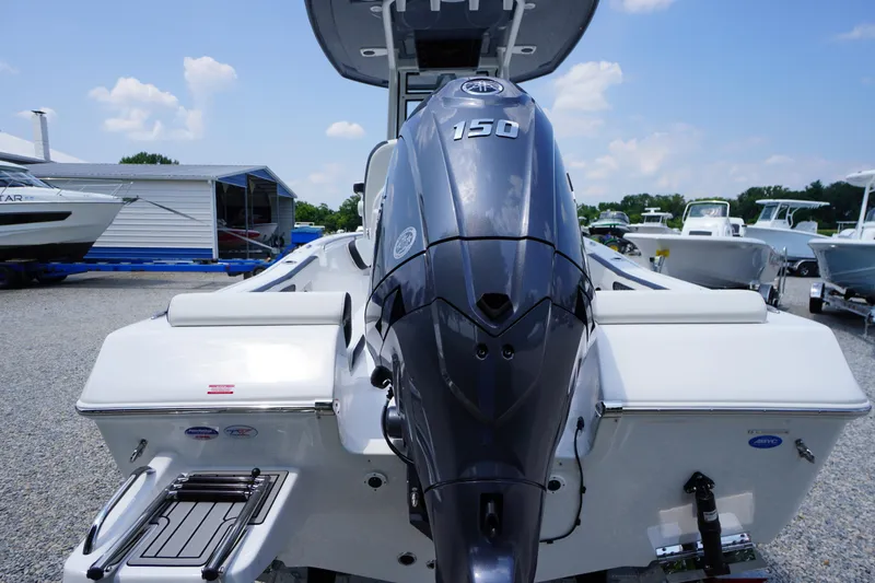 Slide: The Image of 2026 Tidewater 198 CC Adventure boat with powerful 150 engine, displayed outdoors. - 42