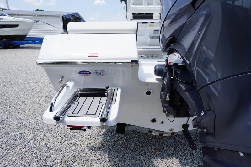 Slide: The Image of 2026 Tidewater 198 CC Adventure boat with swim platform and outboard motor. - 44