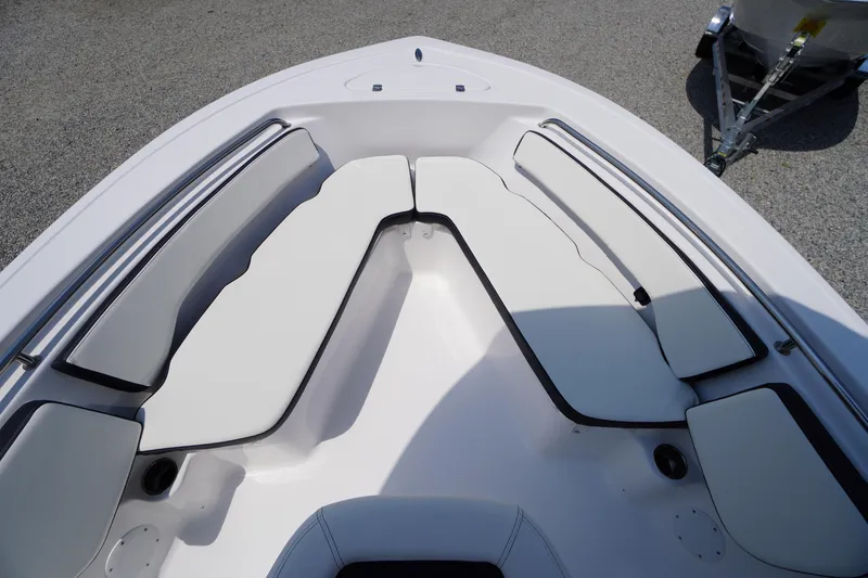 Slide: The Image of 2026 Tidewater 198 CC Adventure boat interior with cushioned seating and sleek design. - 5