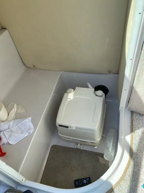 Slide: The Image of Portable toilet in 2006 Four Winns 244 Funship boat interior. - 13