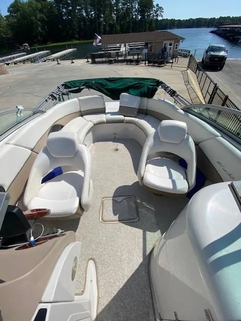 Slide: The Image of 2006 Four Winns 244 Funship boat interior with spacious seating and lake view. - 8
