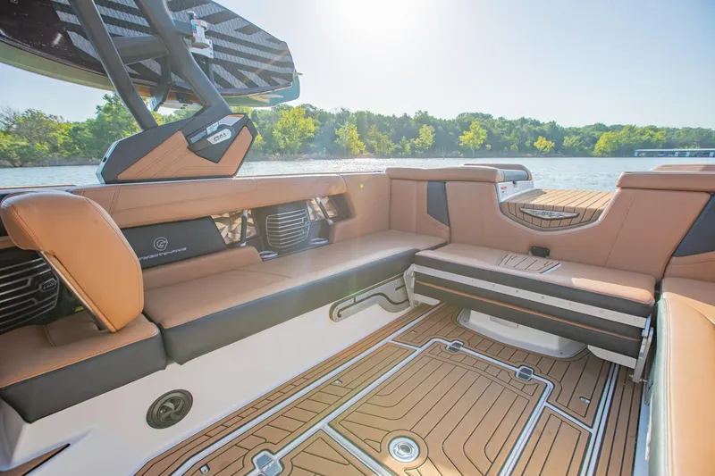 Slide: The Image of 2020 Nautique Super Air Nautique G25 interior with luxurious seating and lake view. - 16