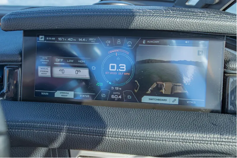 Slide: The Image of 2020 Nautique Super Air Nautique G25 dashboard display with speed and steering controls. - 21