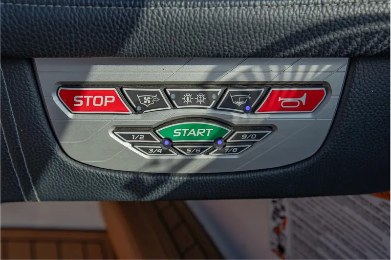 Slide: The Image of Control panel of 2020 Nautique Super Air Nautique G25 with start and stop buttons. - 24