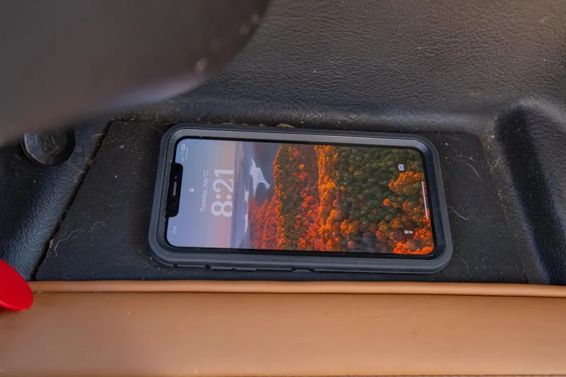 Slide: The Image of Smartphone with nature wallpaper in Nautique Super Air Nautique G25, 2020 model. - 25