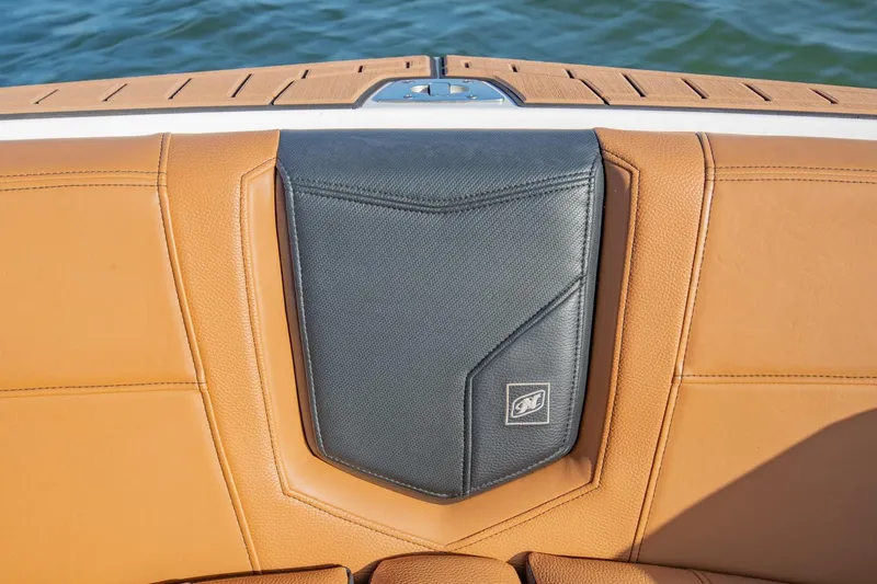 Slide: The Image of 2020 Nautique Super Air Nautique G25 boat seat with tan and black upholstery. - 28