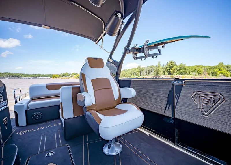 Slide: The Image of Luxurious Paradigm 236 boat interior with plush seating and surfboard holder, 2025 model. - 20