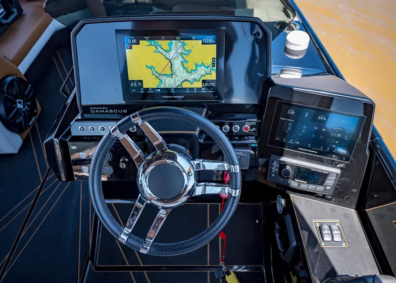 Slide: The Image of Steering console of 2025 Paradigm 236 boat with advanced navigation displays. - 29