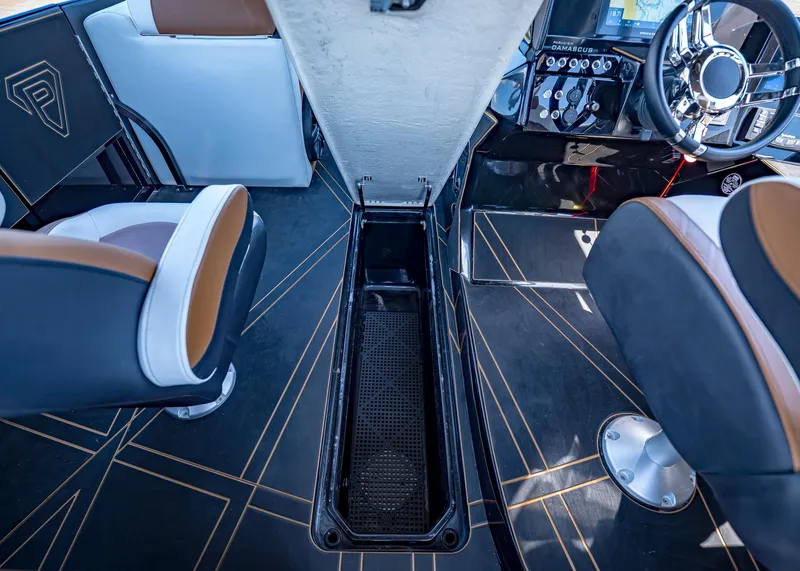 Slide: The Image of Interior of 2025 Paradigm 236 boat with modern seating and sleek dashboard design. - 30