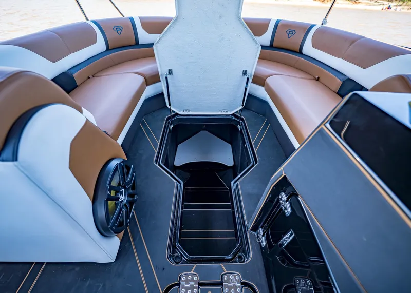 Slide: The Image of Luxurious interior of 2025 Paradigm 236 boat with brown and white seating. - 33