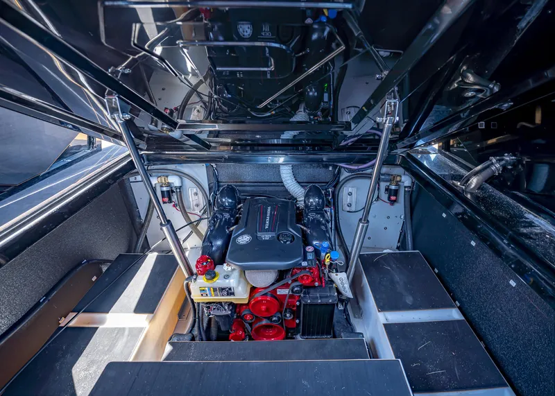 Slide: The Image of Engine compartment of a 2025 Paradigm 236 boat, showcasing modern mechanical components. - 35