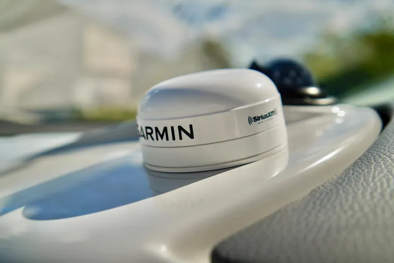 Slide: The Image of Garmin SiriusXM antenna on 2019 Regal 26 Express boat dashboard. - 18