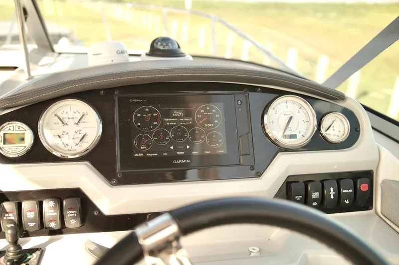 Slide: The Image of Dashboard of a 2019 Regal 26 Express boat with Garmin navigation system. - 19