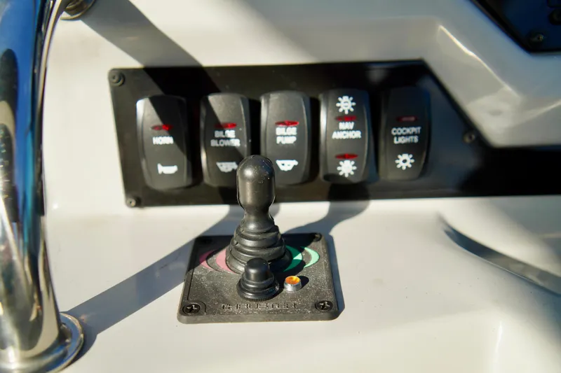 Slide: The Image of Control panel of 2019 Regal 26 Express boat with switches and joystick. - 22