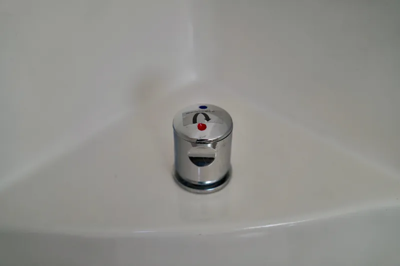 Slide: The Image of Chrome faucet handle on a 2019 Regal 26 Express boat. - 39