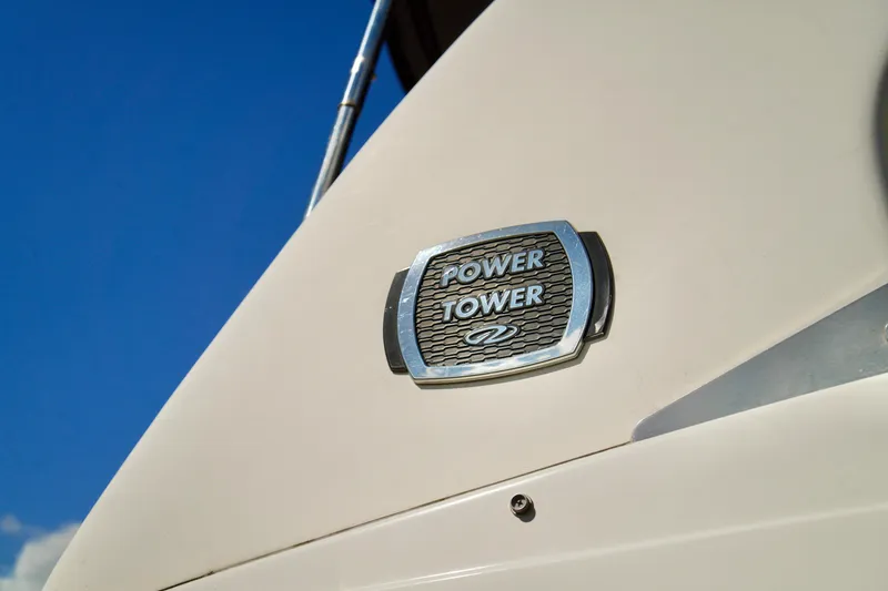 Slide: The Image of 2019 Regal 26 Express boat with Power Tower emblem against blue sky. - 4