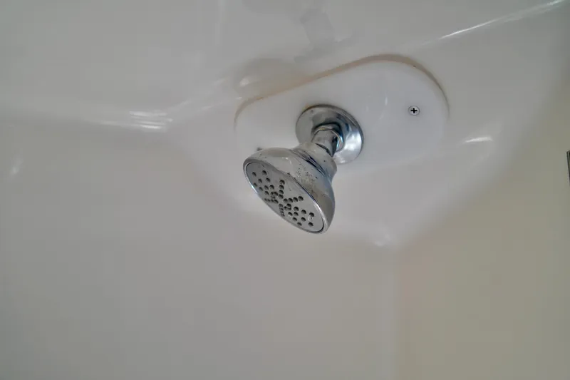 Slide: The Image of Showerhead in 2019 Regal 26 Express boat bathroom, chrome finish, white background. - 40