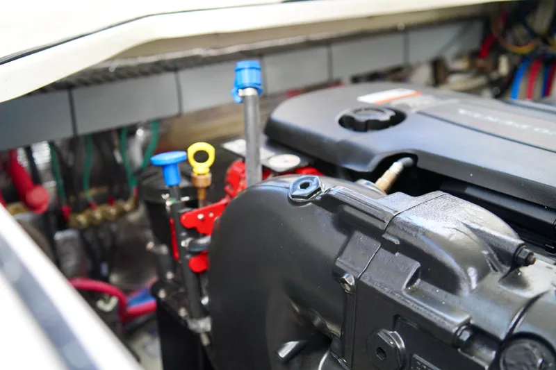 Slide: The Image of Engine compartment of a 2019 Regal 26 Express boat, showcasing mechanical components. - 43