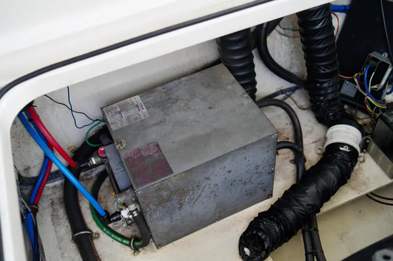 Slide: The Image of 2019 Regal 26 Express engine compartment with wiring and ventilation hoses. - 44