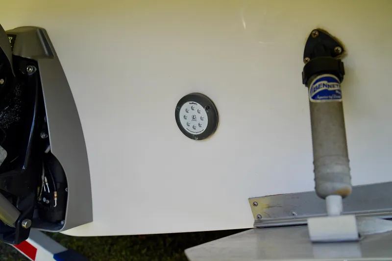 Slide: The Image of 2019 Regal 26 Express boat stern with Bennett trim tab and underwater light. - 46