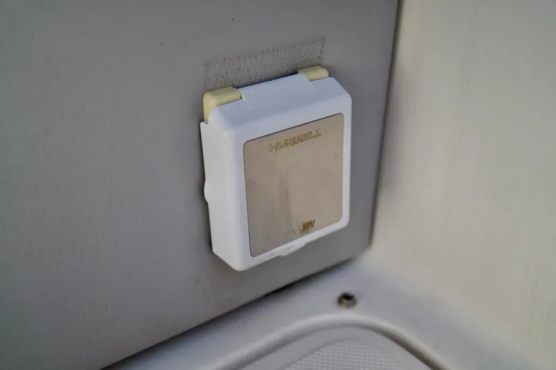 Slide: The Image of Electrical outlet cover on 2019 Regal 26 Express boat. - 49