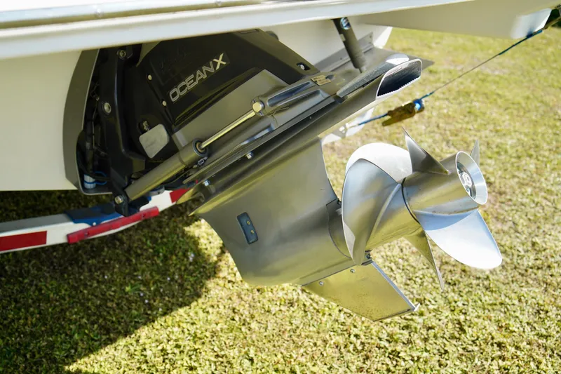 Slide: The Image of 2019 Regal 26 Express boat propeller and drive system on grass. - 51