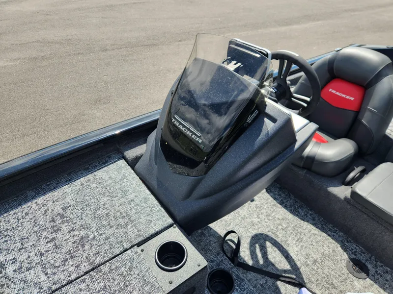 Slide: The Image of 2025 Tracker Pro Team 195 Tournament Edition boat interior with steering console and seating. - 10