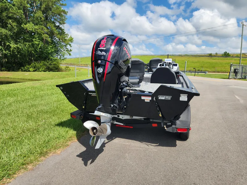Slide: The Image of 2025 Tracker Pro Team 195 Tournament Edition boat with powerful outboard motor on trailer. - 3