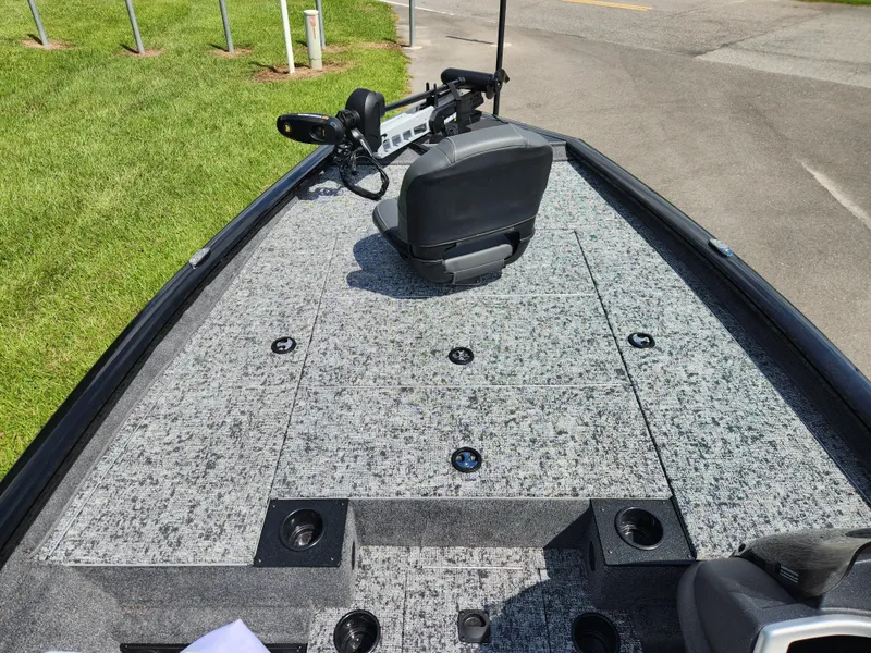 Slide: The Image of 2025 Tracker Pro Team 195 Tournament Edition boat deck with seating and storage compartments. - 8