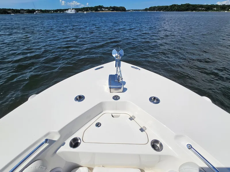 Slide: The Image of 2024 Key West 244 Center Console boat on calm water, featuring sleek bow design. - 10
