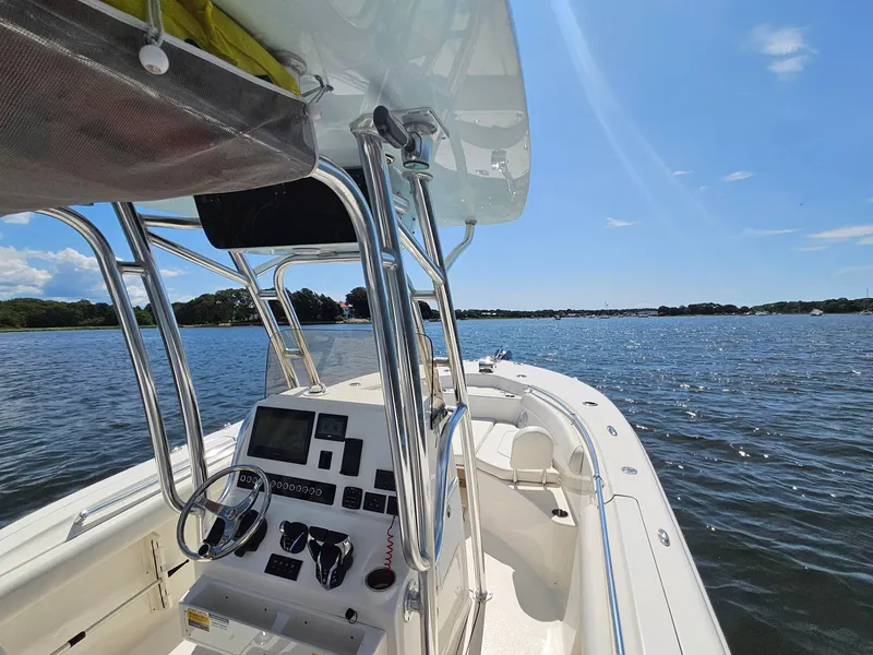 Slide: The Image of 2024 Key West 244 Center Console boat on a sunny day, overlooking calm waters. - 15
