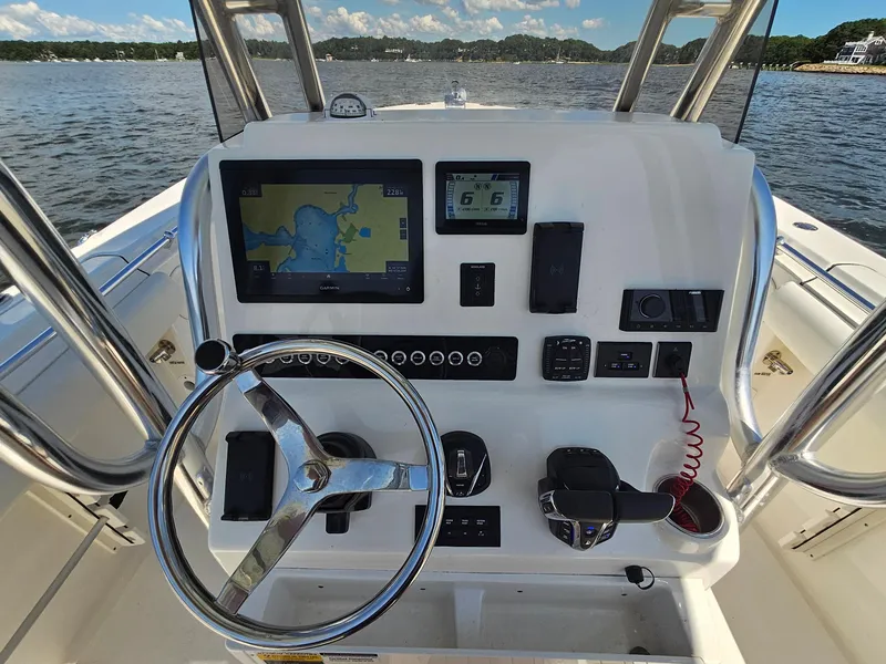 Slide: The Image of 2024 Key West 244 Center Console boat dashboard with navigation and control systems. - 20