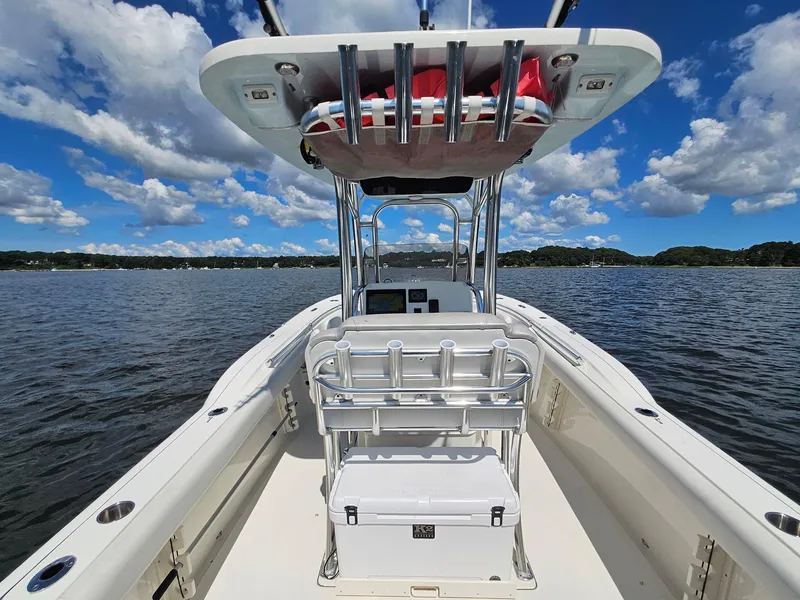 Slide: The Image of 2024 Key West 244 Center Console boat on calm water under a blue sky. - 24