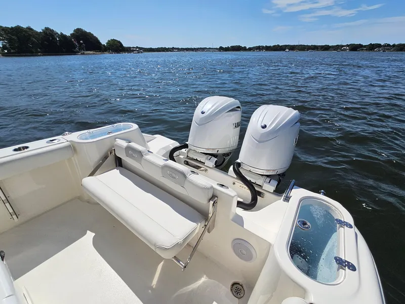 Slide: The Image of 2024 Key West 244 Center Console boat with twin engines on a sunny day. - 26