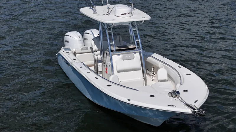 Slide: The Image of 2024 Key West 244 Center Console boat on water, featuring dual Yamaha engines. - 7