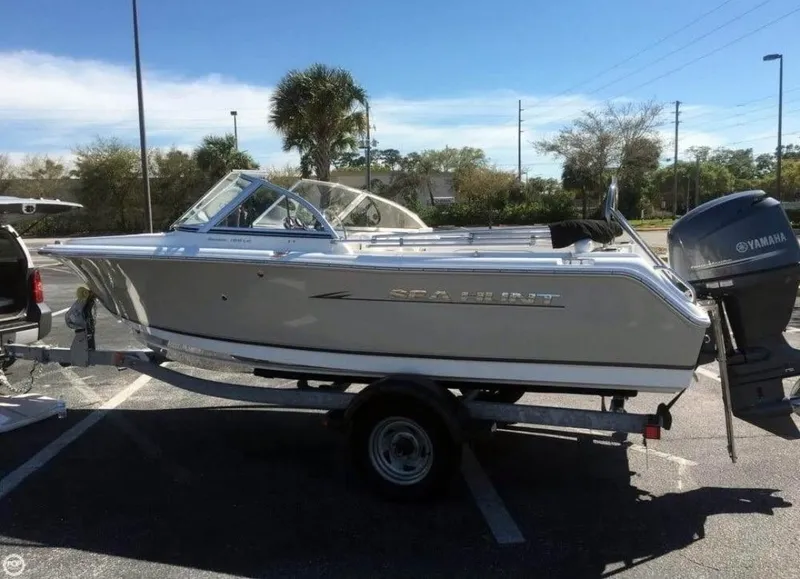 Slide: The Image of 2013 Sea Hunt Escape 188 boat on trailer with Yamaha outboard motor. - 1