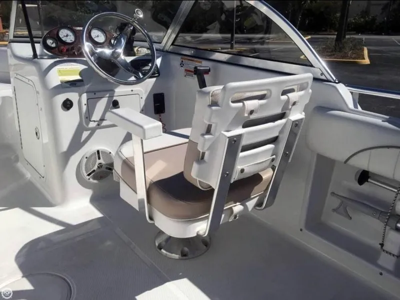 Slide: The Image of Interior of 2013 Sea Hunt Escape 188 boat with steering wheel and seating. - 6