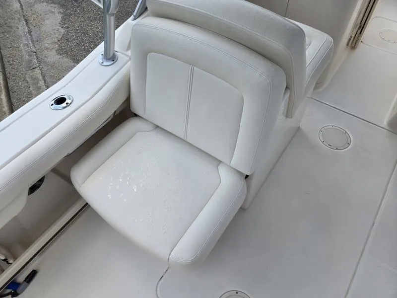 Slide: The Image of 2019 Grady-White Freedom 235 boat seat, white upholstery, clean and well-maintained. - 11