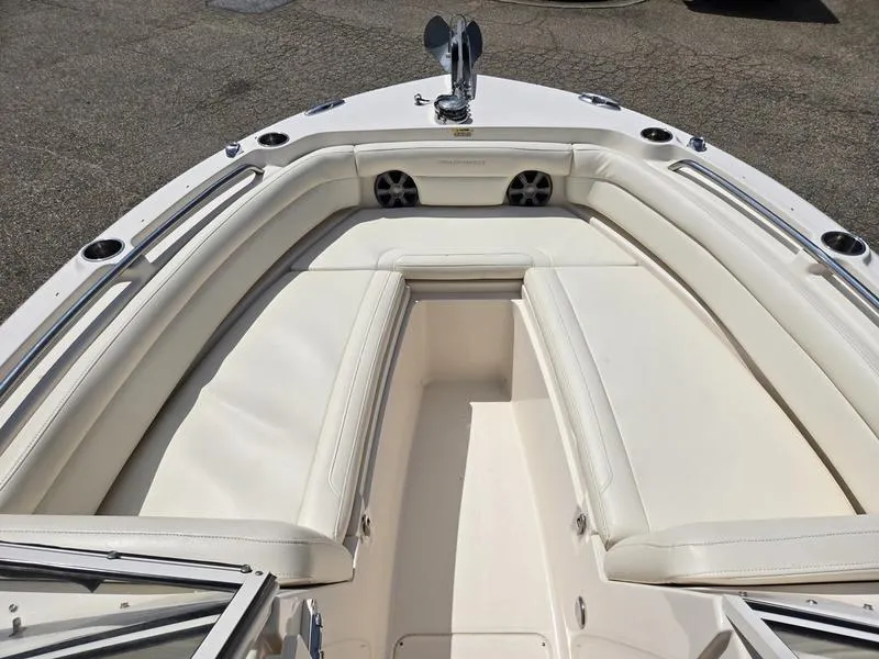 Slide: The Image of 2019 Grady-White Freedom 235 boat interior with white cushioned seating. - 19