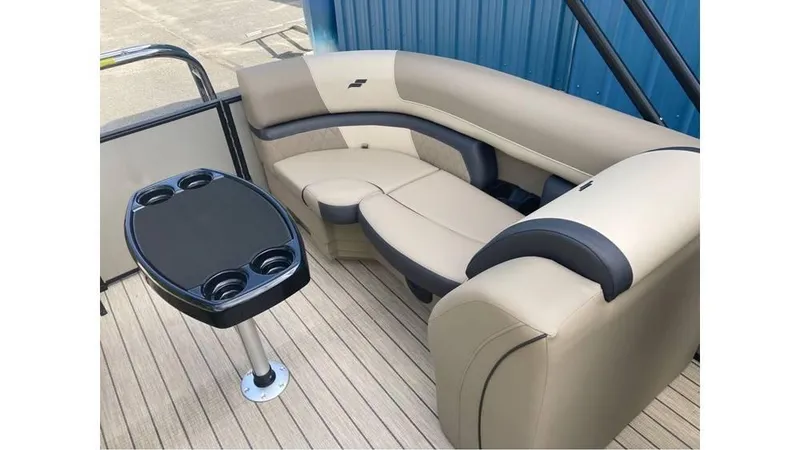 Slide: The Image of Luxurious seating area on 2026 Starcraft EXS 1 boat with cupholder table. - 3