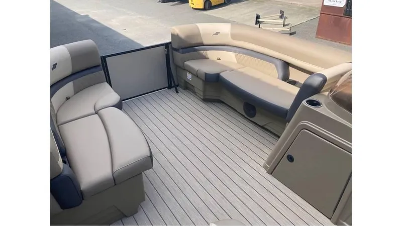 Slide: The Image of Luxurious interior of 2026 Starcraft EXS 1 boat with beige seating and wood-style flooring. - 6