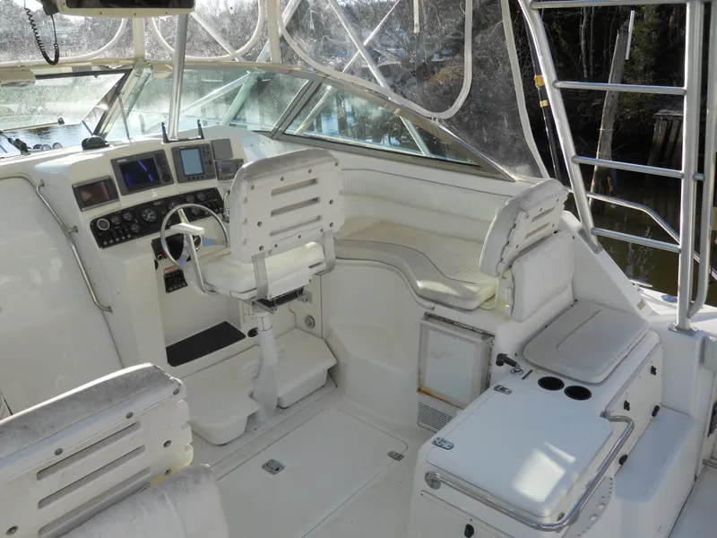 Slide: The Image of Boston Whaler 34 Defiance 2000 cockpit with helm, seating, and navigation equipment. - 11