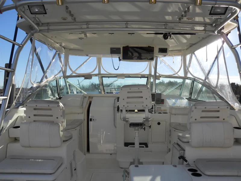Slide: The Image of Interior view of 2000 Boston Whaler 34 Defiance boat cockpit with seating and controls. - 12