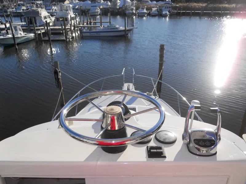 Slide: The Image of Boston Whaler 34 Defiance helm overlooking marina, sunny day, 2000 model. - 18