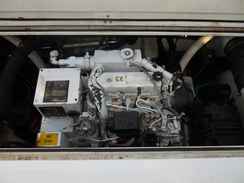 Slide: The Image of Engine compartment of a 2000 Boston Whaler 34 Defiance boat. - 21